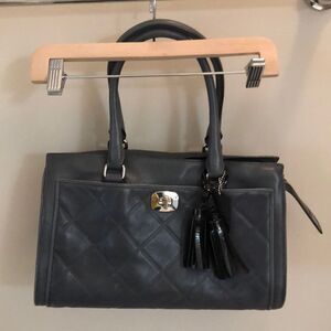 Coach Handbag with tassel and zip Closure